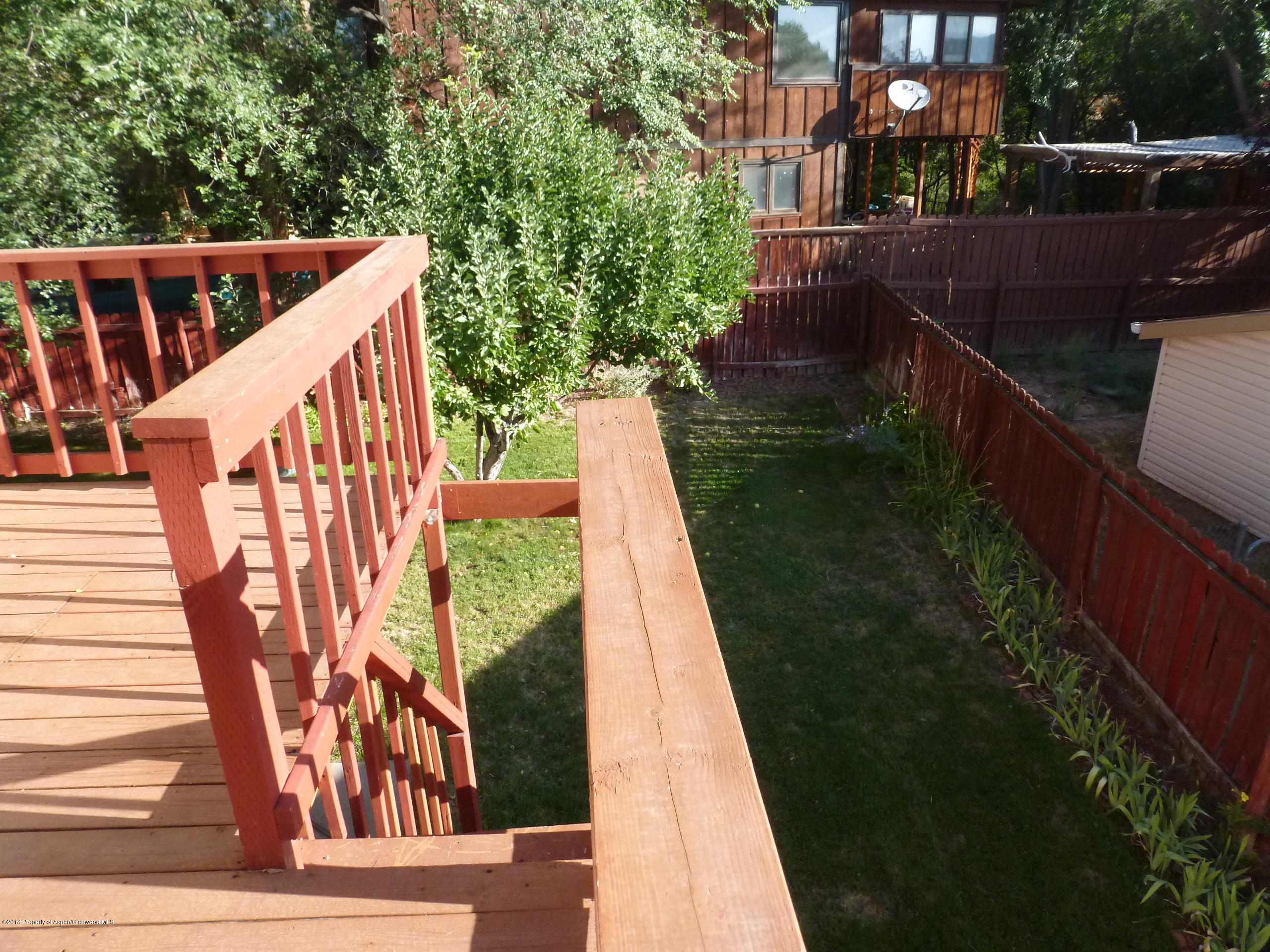810 East 5th Street Rifle, CO 81650 - Photo 9 of 13 a balcony with wooden floor