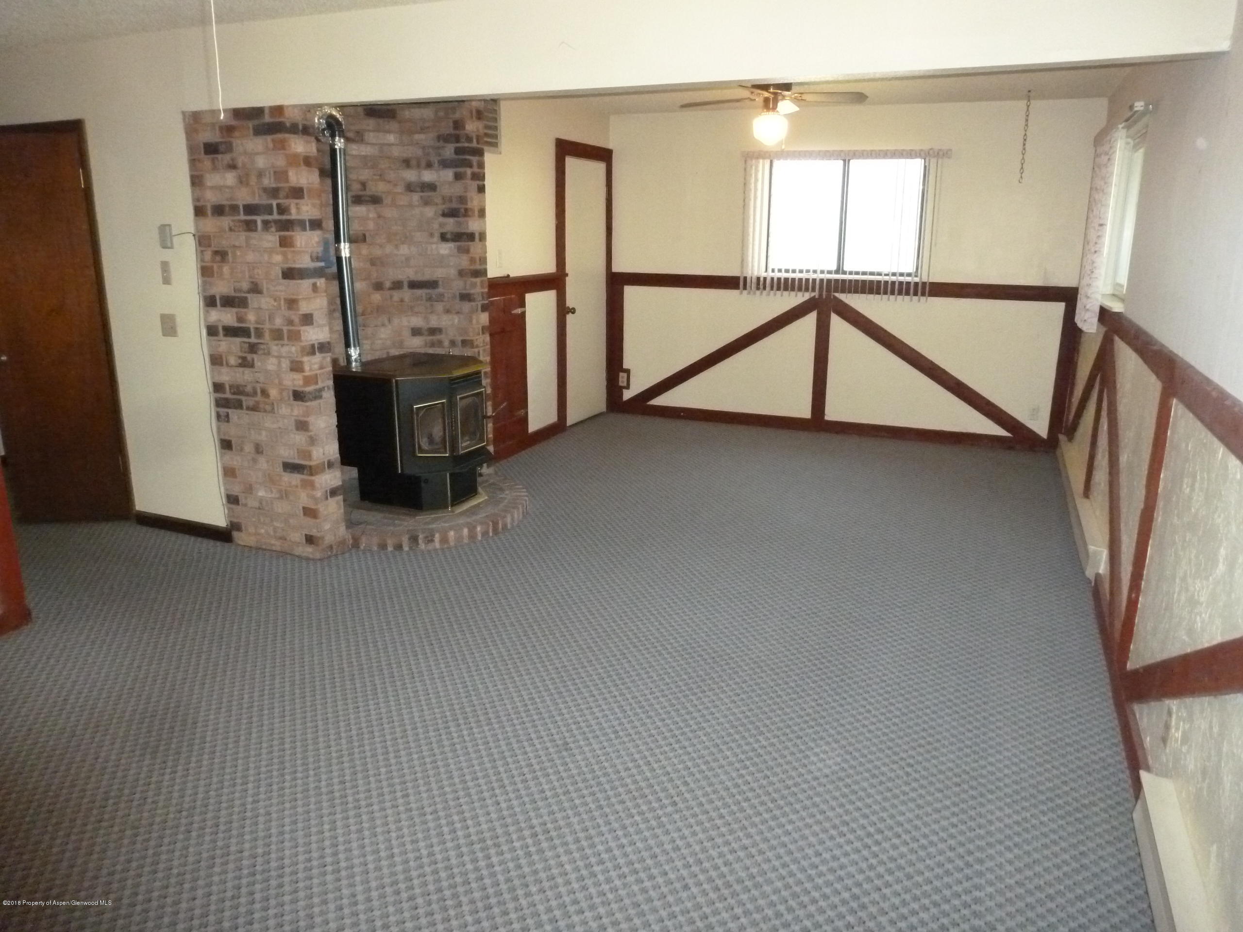 810 East 5th Street Rifle, CO 81650 - Photo 10 of 13 a view of staircase with fireplace