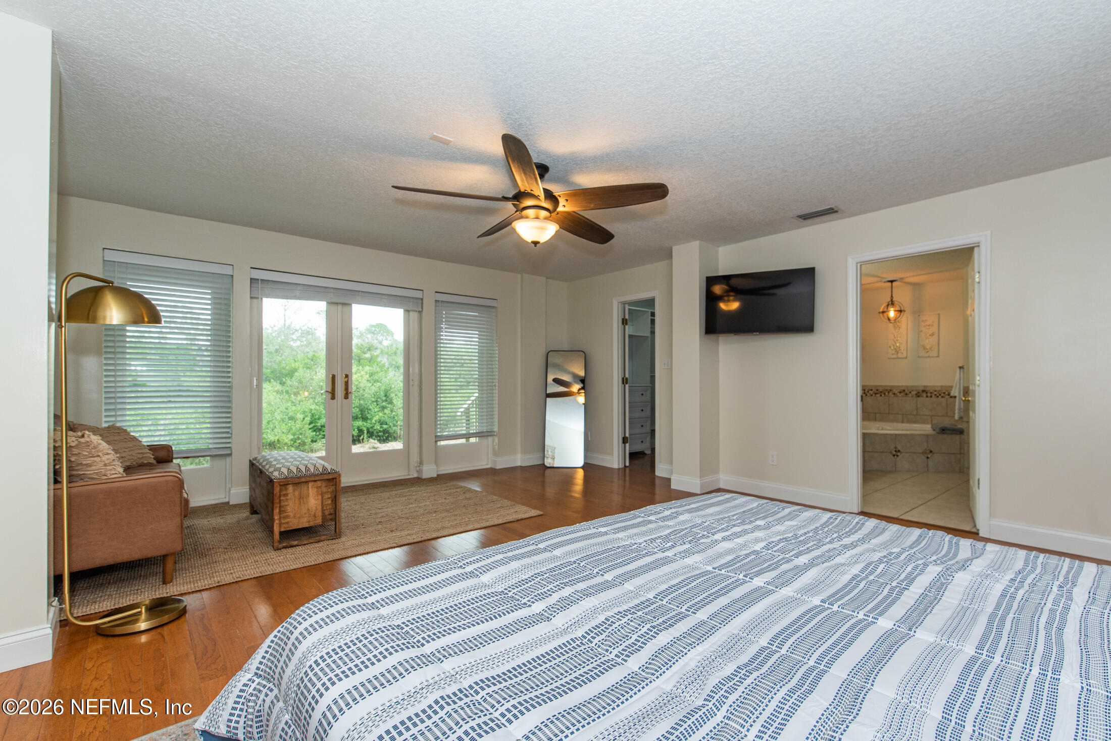 35 Oak Street St. Augustine, FL 32084 - Photo 15 of 43 a bed room with a bed and a chandelier
