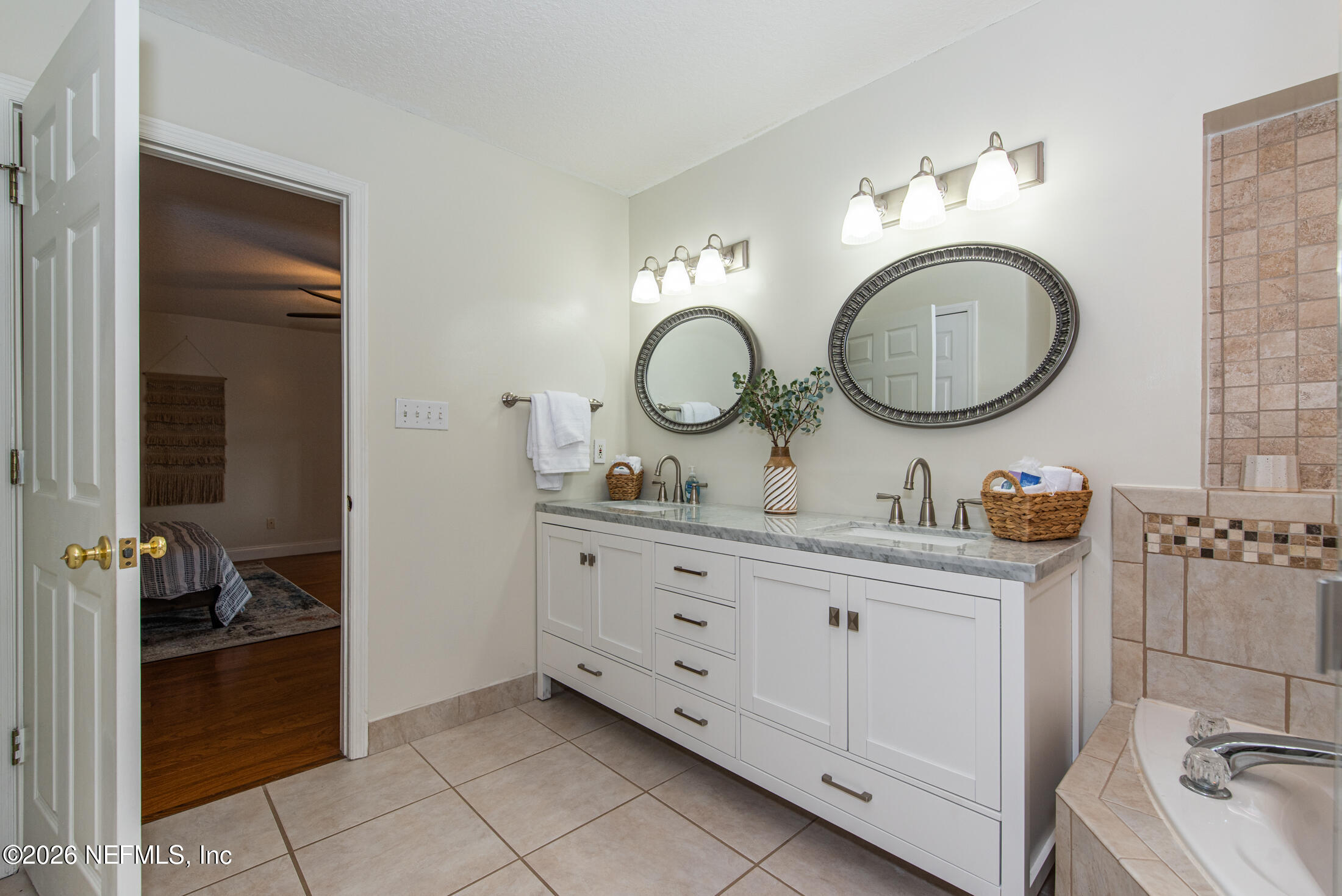 35 Oak Street St. Augustine, FL 32084 - Photo 17 of 43 a bathroom with a granite countertop double vanity sink and a mirror