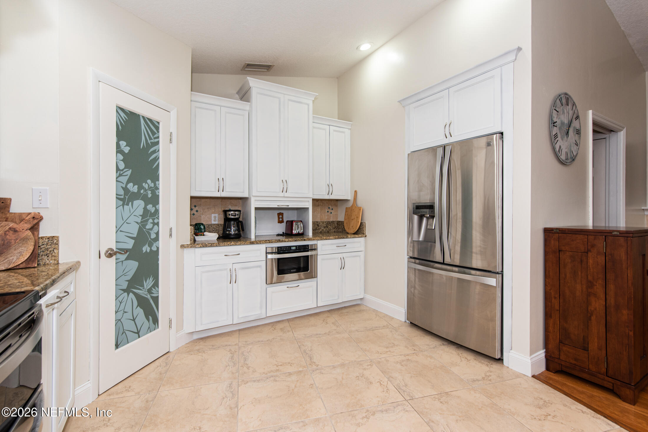 35 Oak Street St. Augustine, FL 32084 - Photo 30 of 43 a kitchen with stainless steel appliances a refrigerator sink and cabinets