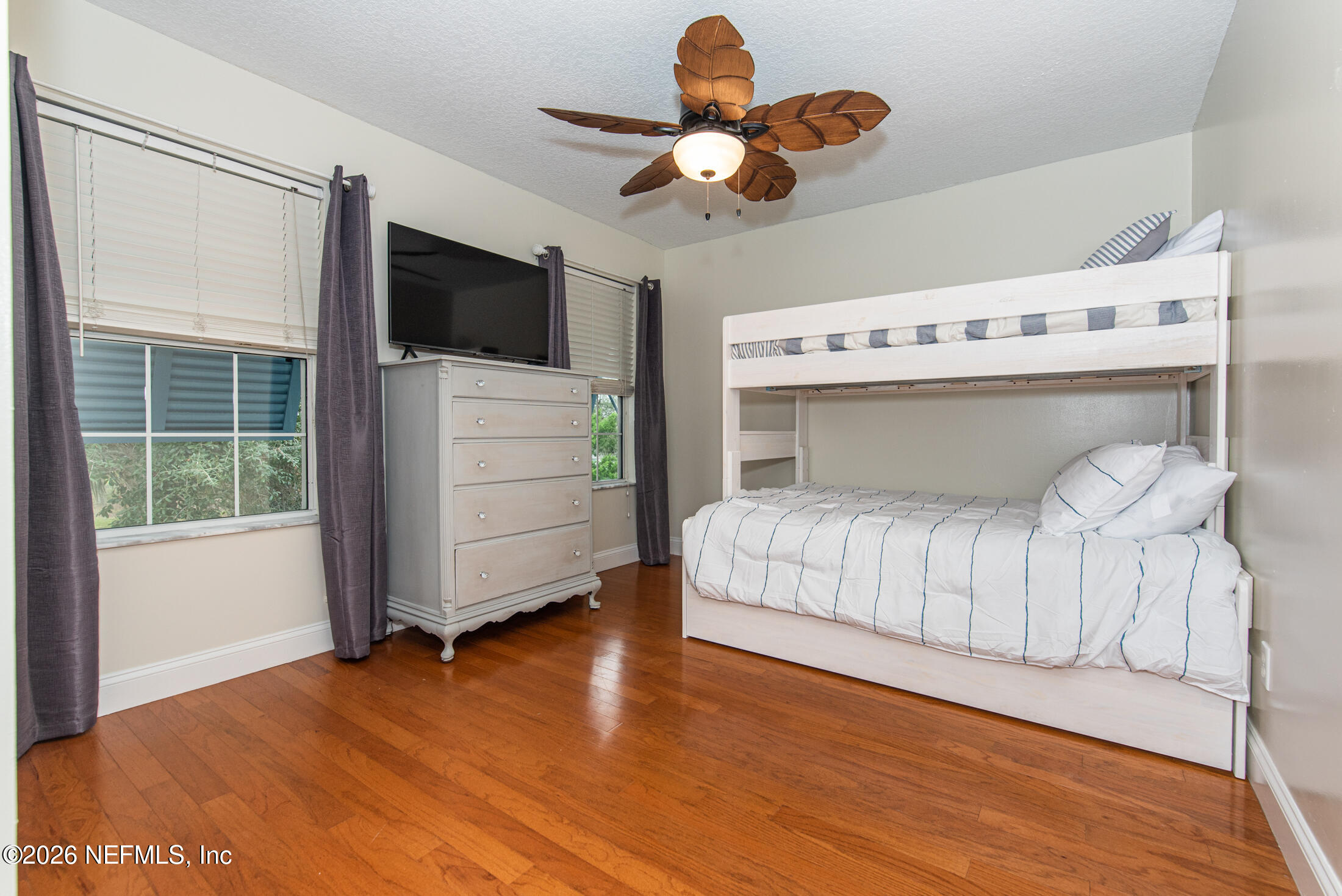 35 Oak Street St. Augustine, FL 32084 - Photo 32 of 43 a bedroom with a bed and a television