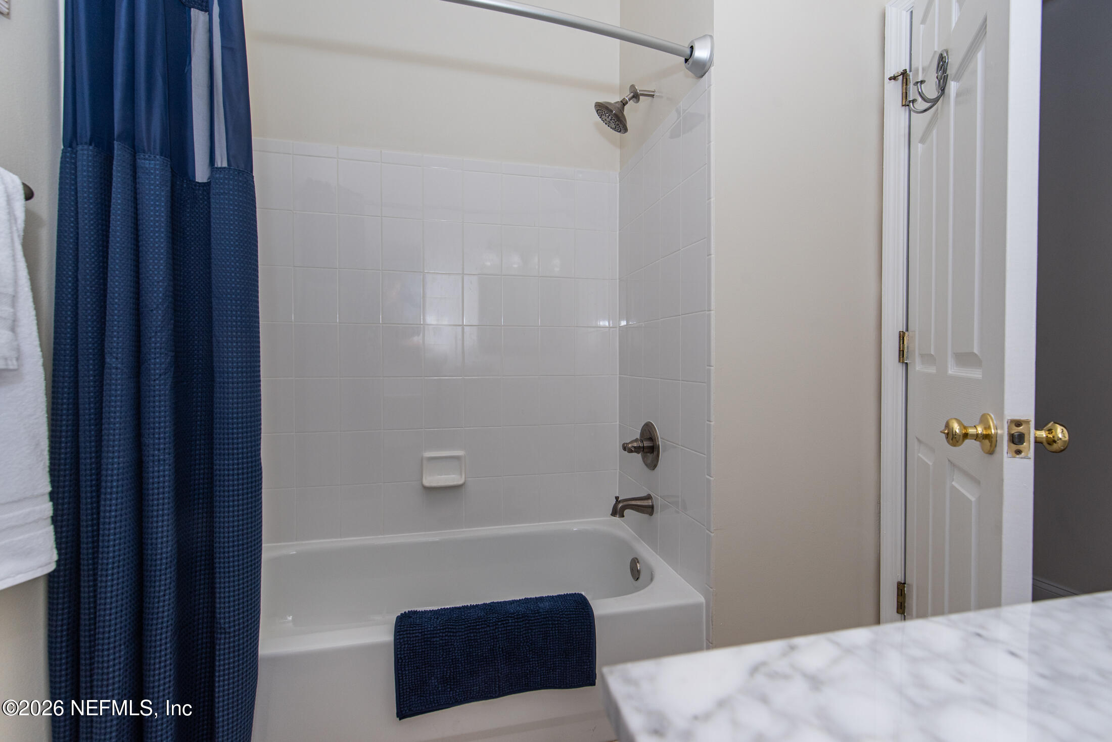 35 Oak Street St. Augustine, FL 32084 - Photo 35 of 43 a bathroom with a bathtub and a shower