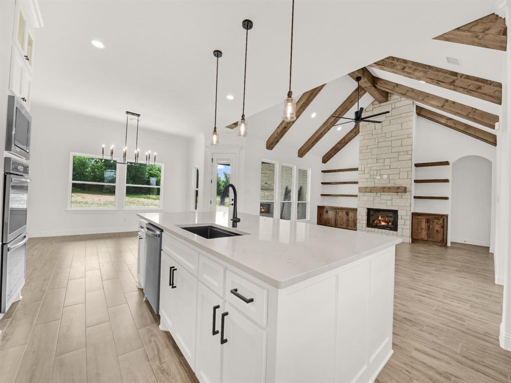 143 Desperado Way Weatherford, TX 76088 - Photo 8 of 36 Kitchen with a sink, a ceiling fan, appliances with stainless steel finishes, recessed lighting, and light wood-style flooring