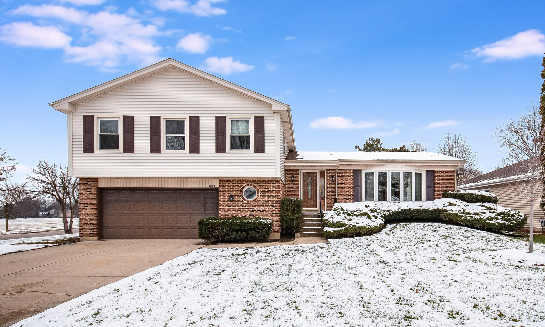 2880 Sun Valley Road Lisle, IL 60532 - Photo 1 of 29 a front view of a house with a yard