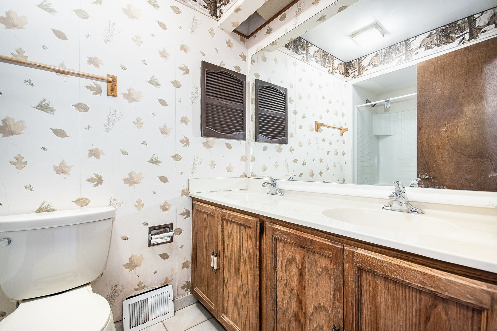 2880 Sun Valley Road Lisle, IL 60532 - Photo 18 of 29 a bathroom with a sink toilet a mirror and shower