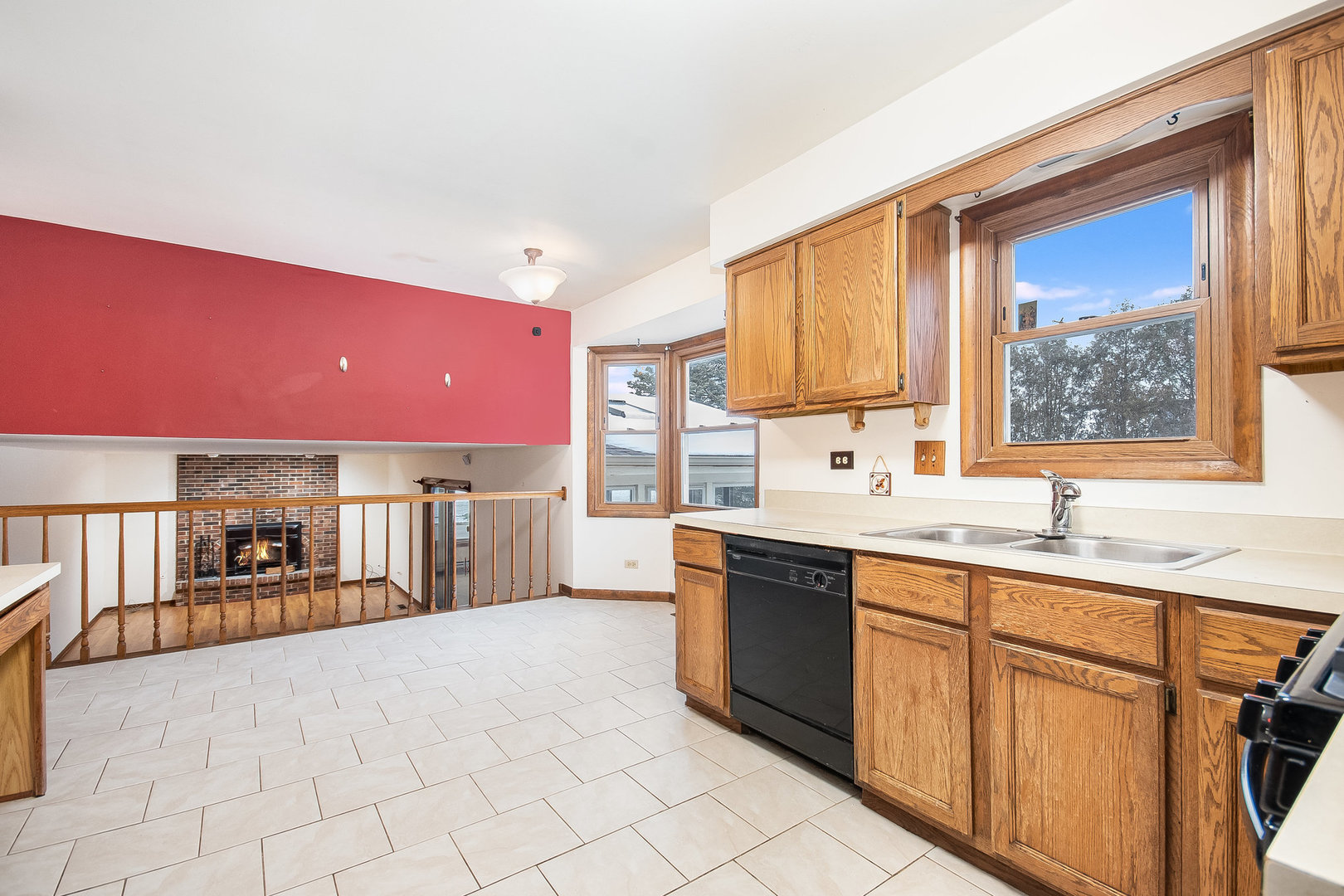 2880 Sun Valley Road Lisle, IL 60532 - Photo 7 of 29 a large kitchen with stainless steel appliances a sink counter space and a window