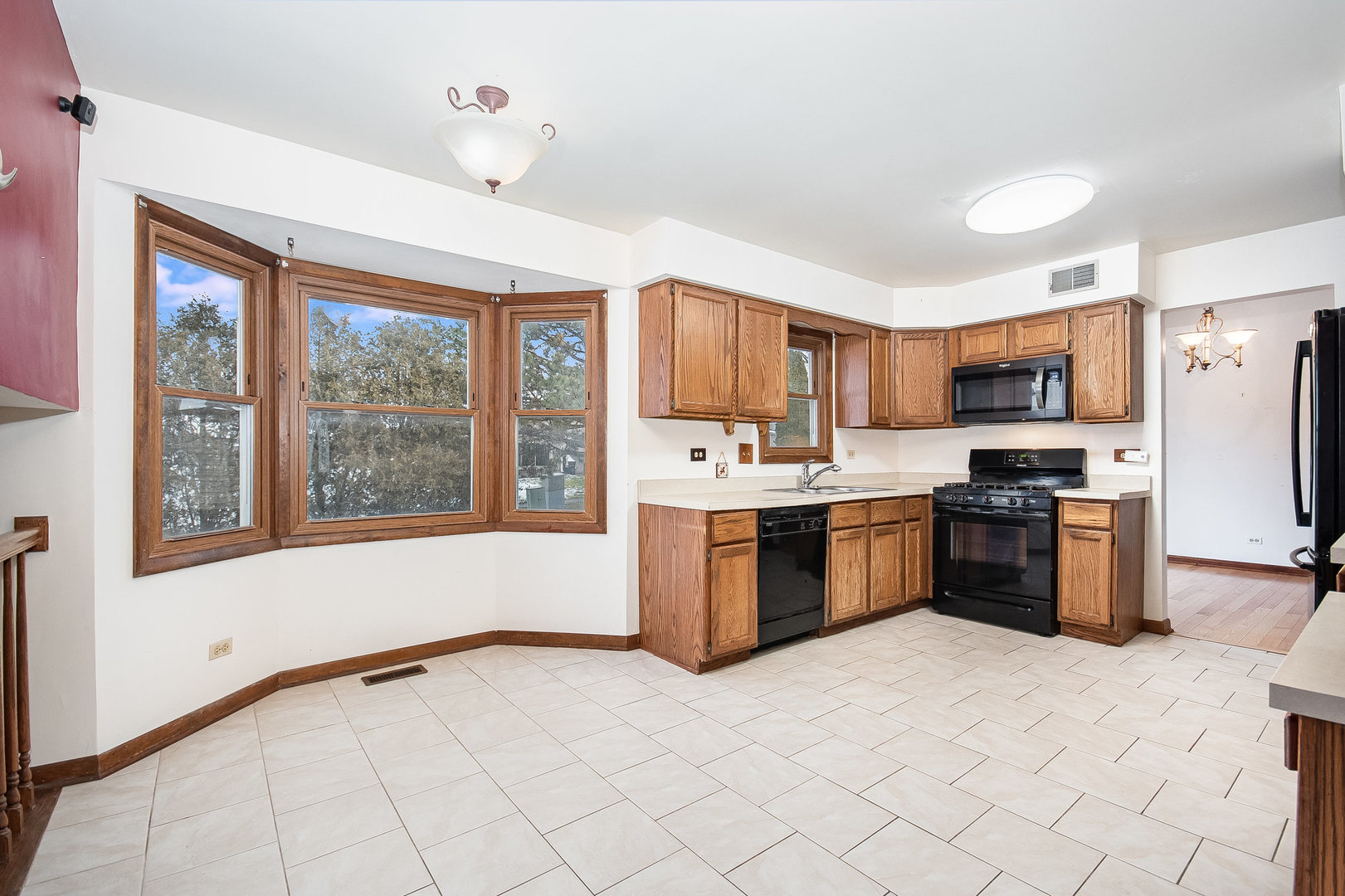2880 Sun Valley Road Lisle, IL 60532 - Photo 8 of 29 a kitchen with stainless steel appliances granite countertop a stove top oven a sink a refrigerator and a granite counter top