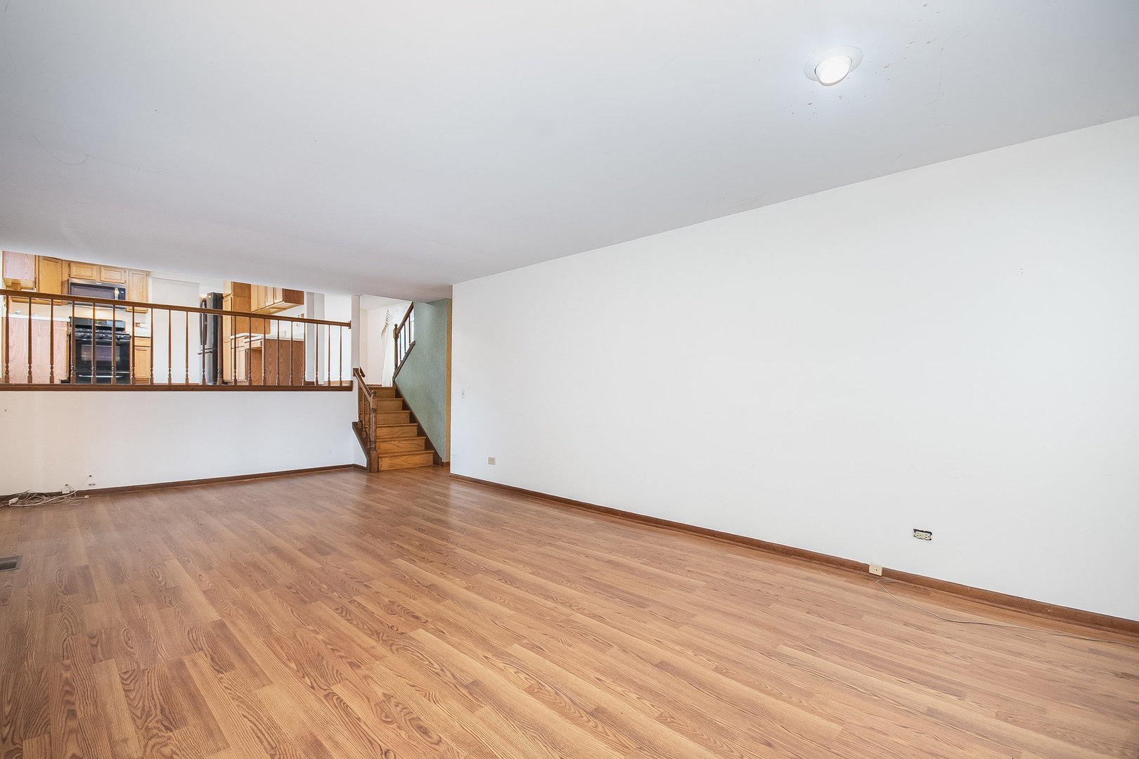 2880 Sun Valley Road Lisle, IL 60532 - Photo 10 of 29 a view of a big room with wooden floor and an empty room