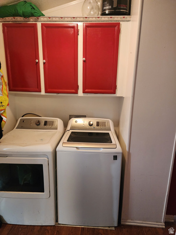 11362 Crescent Park Way, Unit 8 Sandy, UT 84070 - Photo 14 of 20 Laundry room featuring washing machine and dryer, cabinet space, and dark wood-style floors