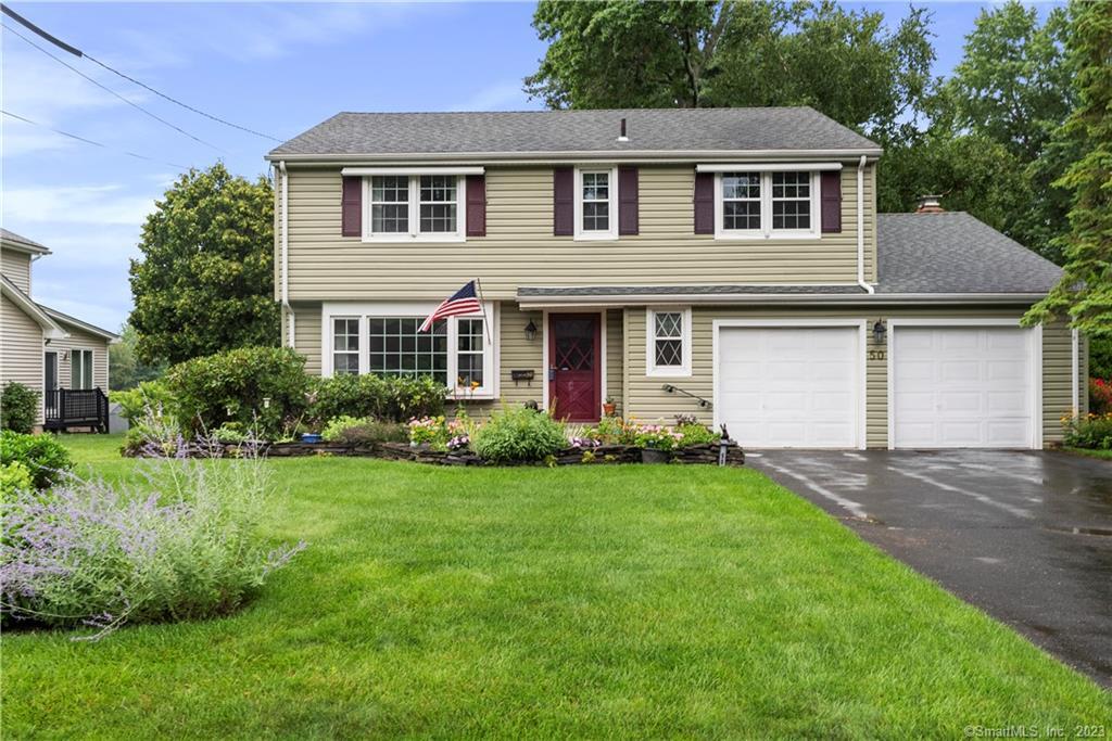 50 Midwell Road Wethersfield, CT 06109 - Photo 1 of 1 a front view of a house with a yard and garage