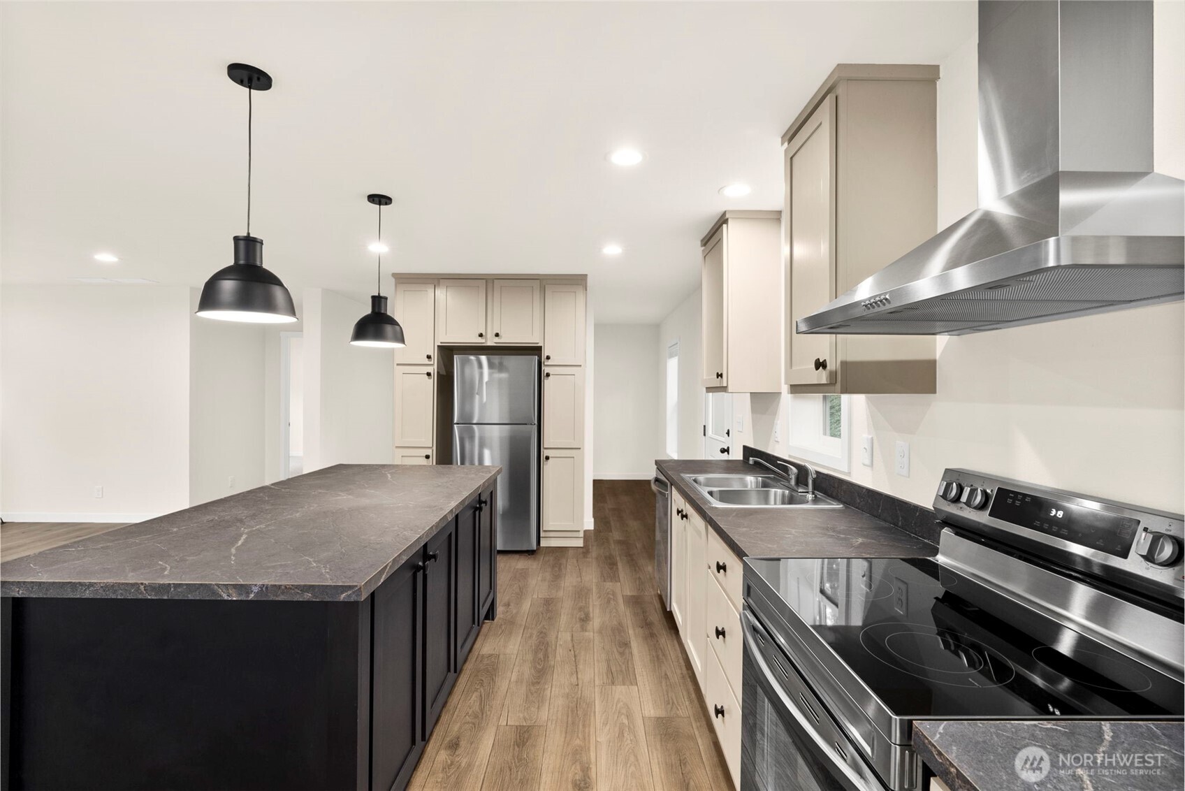 241 Pascoe Avenue Chehalis, WA 98532 - Photo 11 of 33 a kitchen with stainless steel appliances granite countertop a stove a sink a refrigerator and wooden cabinets