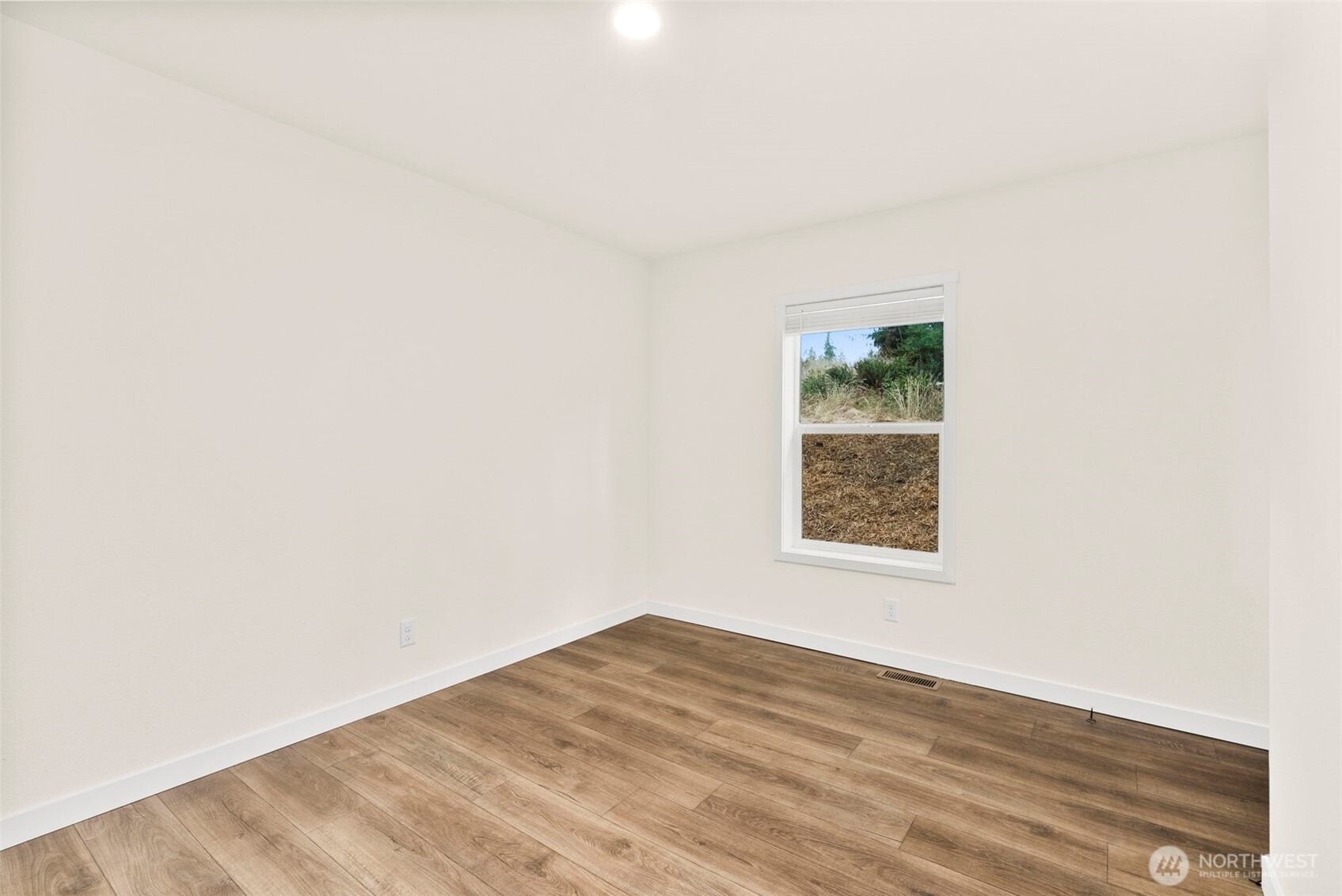241 Pascoe Avenue Chehalis, WA 98532 - Photo 12 of 33 a view of a big room with wooden floor and a window