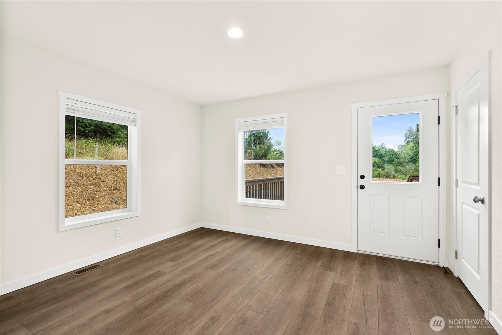 241 Pascoe Avenue Chehalis, WA 98532 - Photo 24 of 33 an empty room with wooden floor and windows