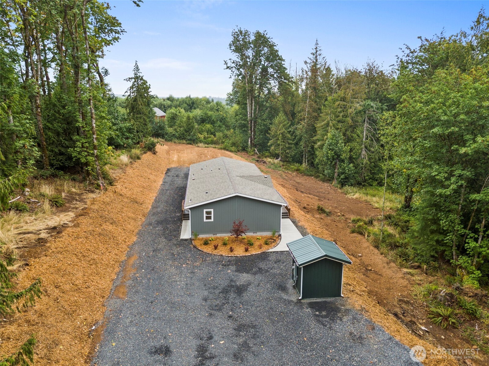 241 Pascoe Avenue Chehalis, WA 98532 - Photo 27 of 33 a backyard of a house with a yard and outdoor seating