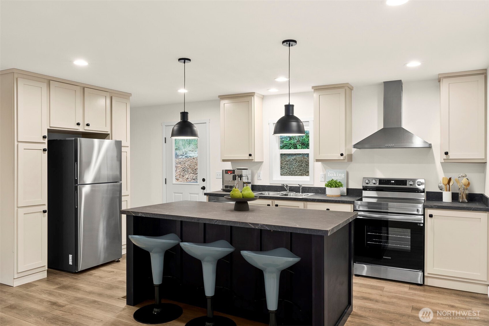 241 Pascoe Avenue Chehalis, WA 98532 - Photo 10 of 33 a kitchen with stainless steel appliances granite countertop a stove a refrigerator a sink a stove a dining table and chairs