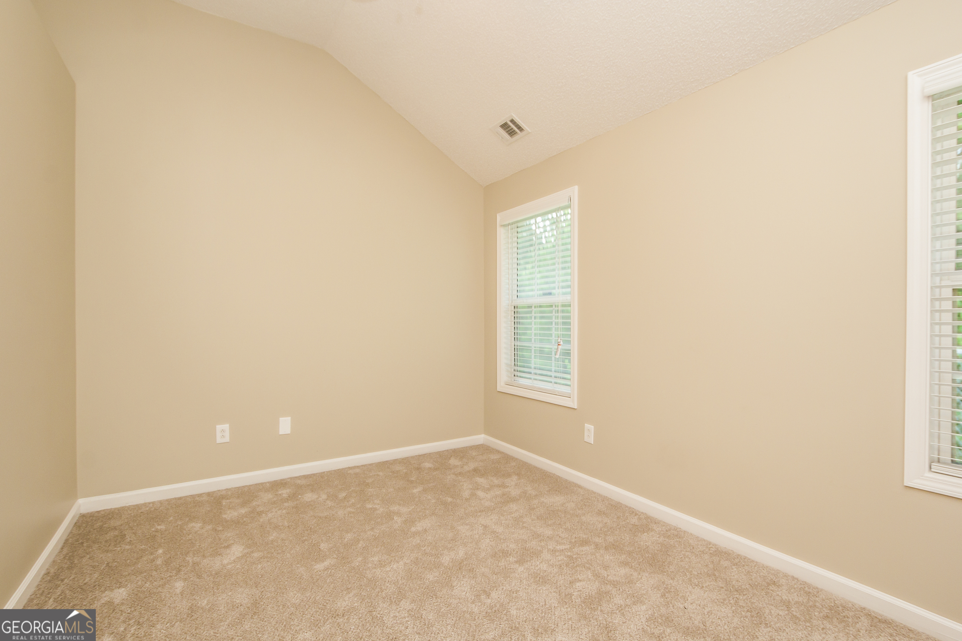 4980 Wolfcreek View South Fulton, GA 30349 - Photo 12 of 15 an empty room with a window