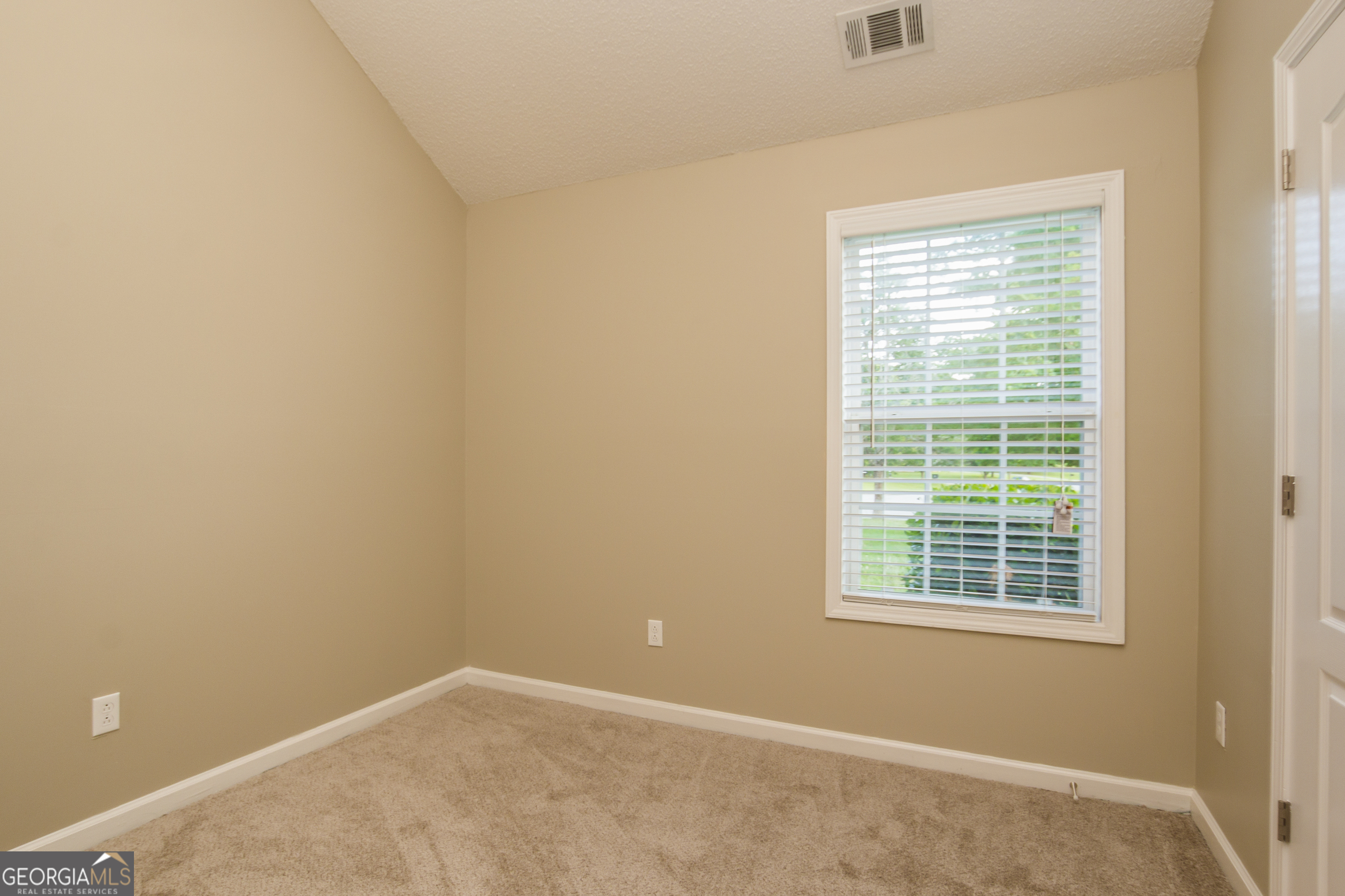 4980 Wolfcreek View South Fulton, GA 30349 - Photo 13 of 15 an empty room with a window