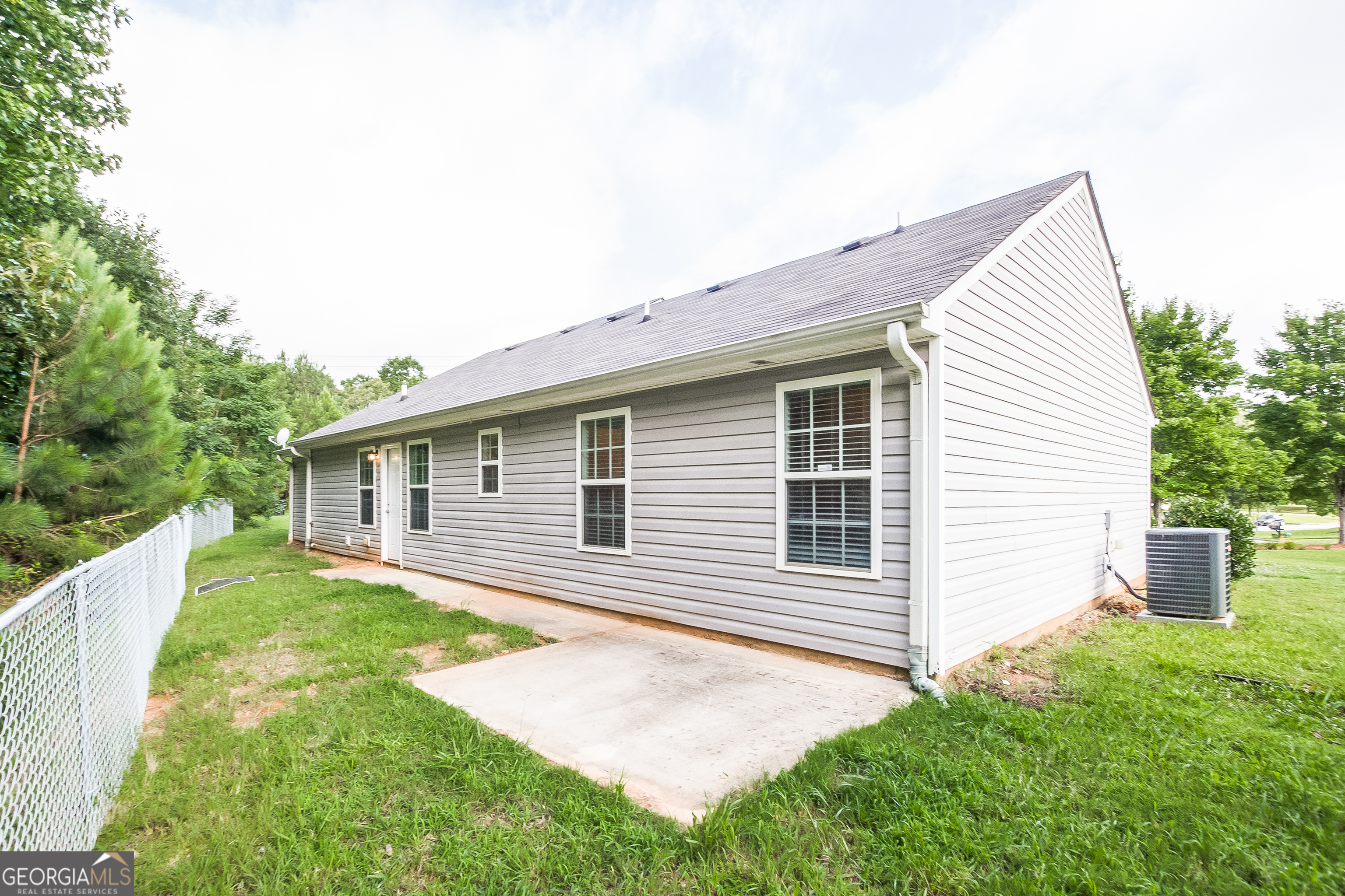 4980 Wolfcreek View South Fulton, GA 30349 - Photo 15 of 15 a backyard of a house with table and chairs