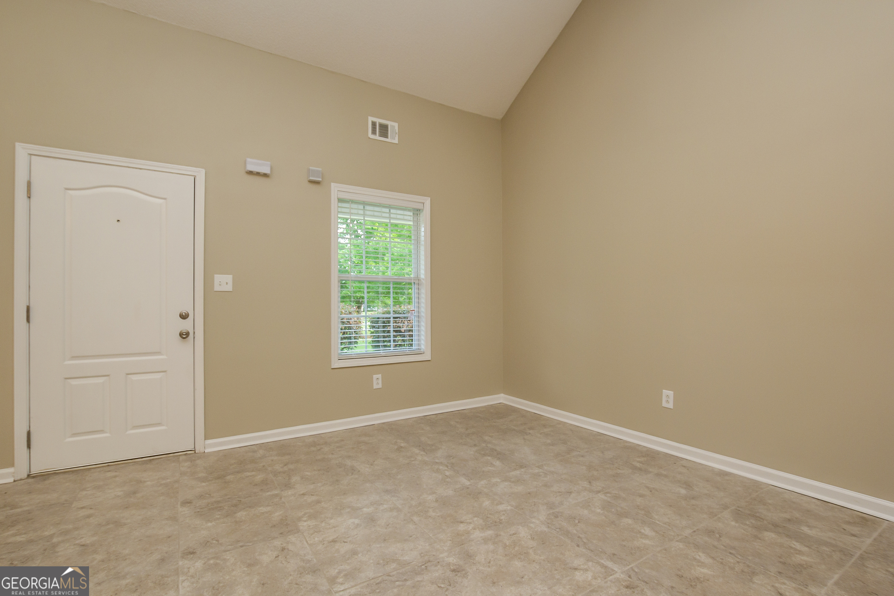 4980 Wolfcreek View South Fulton, GA 30349 - Photo 3 of 15 an empty room with windows