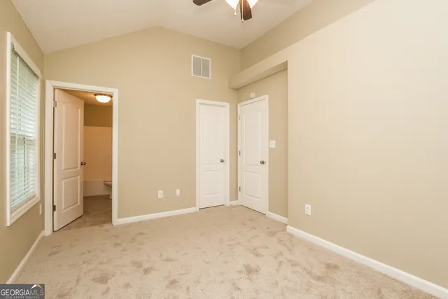 an empty room with a bathroom