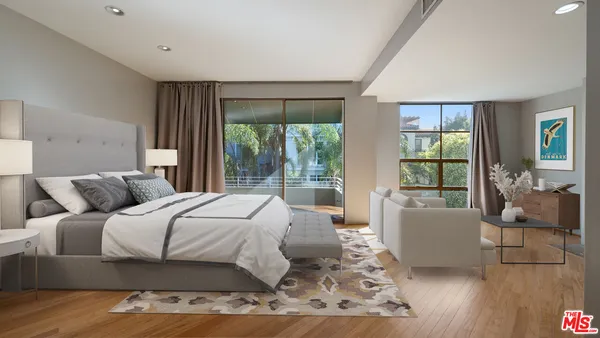 a bedroom with a large bed and a large window