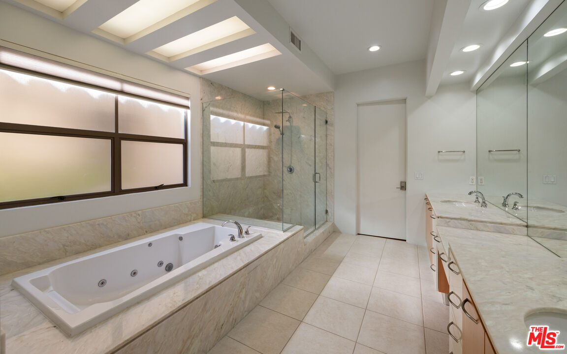 143 Union Jack Mall Marina del Rey, CA 90292 - Photo 16 of 48 a large spacious bathroom with a tub a double vanity sink and mirror