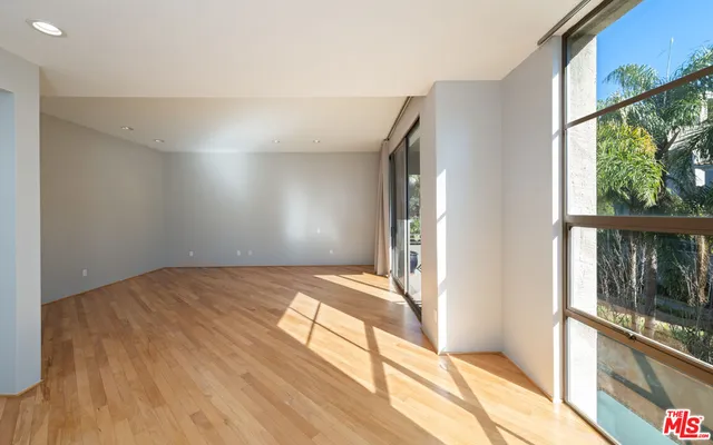a view of bedroom with a bed and wooden floor