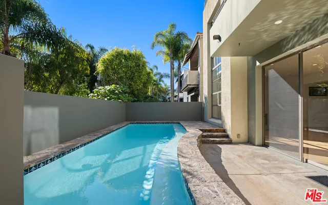 a view of a backyard of the house