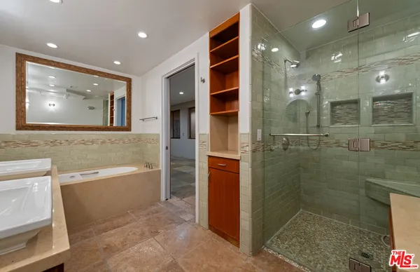a view of a kitchen with a sink and a large window