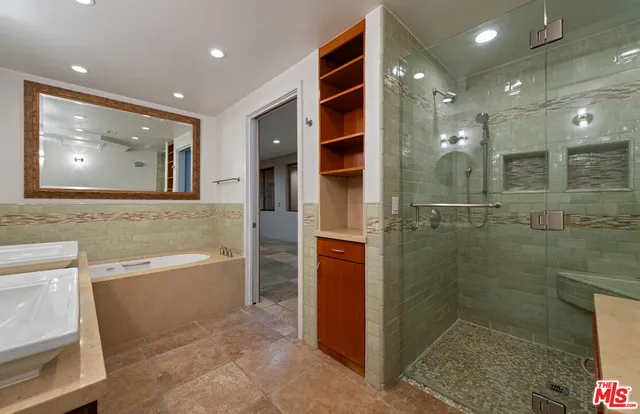 a view of a kitchen with a sink and a large window