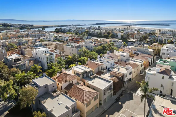 an aerial view of a building with parking