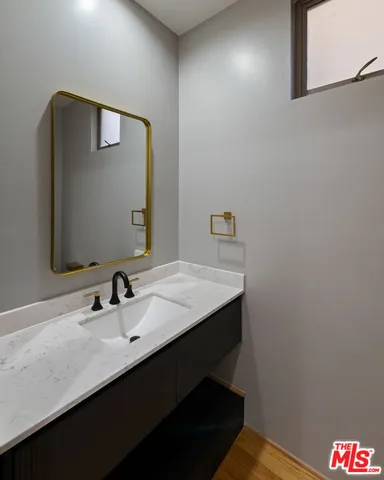 a bathroom with a sink and a mirror