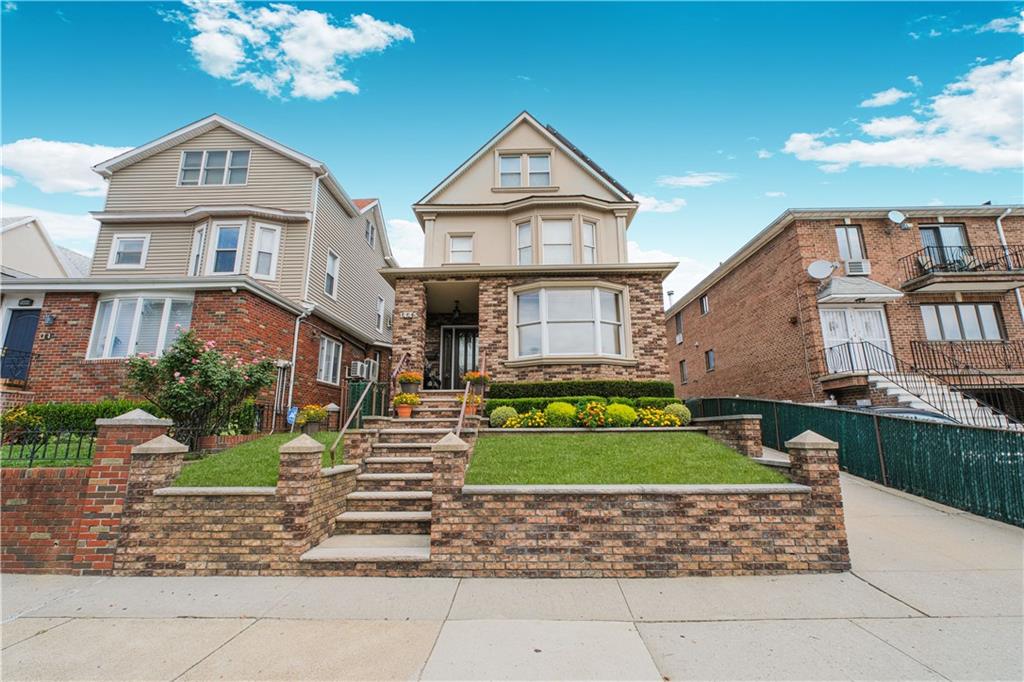 1445 Bay Ridge Parkway Brooklyn, NY 11228 - Photo 2 of 5 a front view of a house with a garden