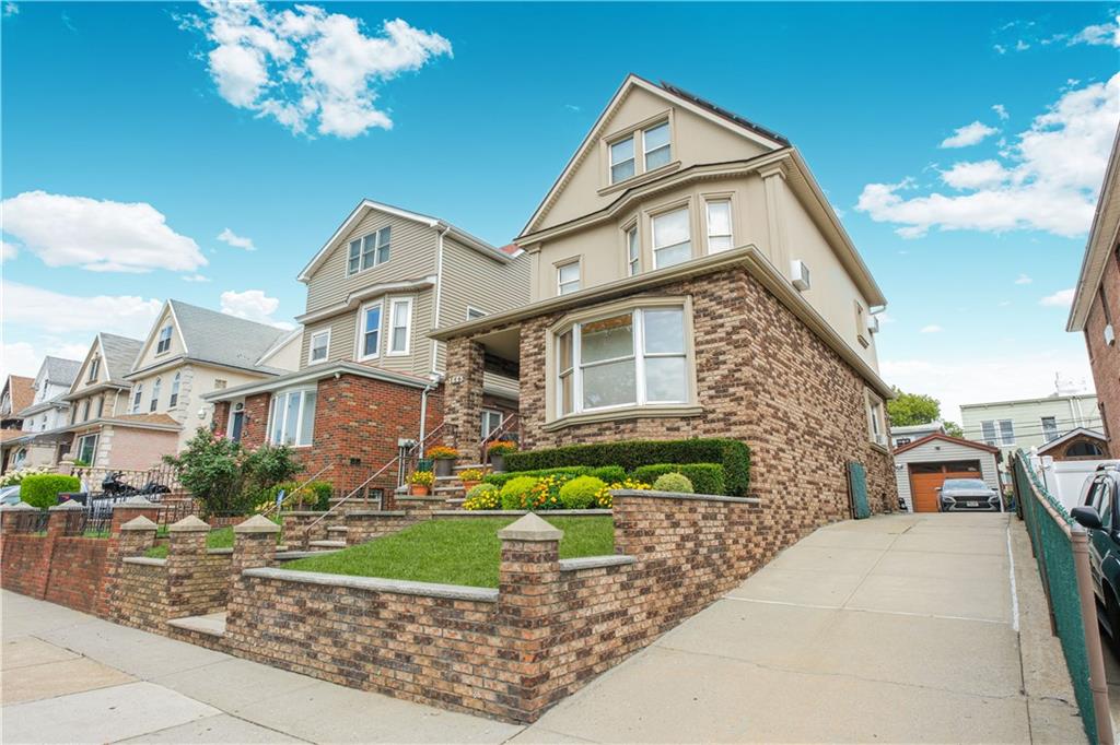 1445 Bay Ridge Parkway Brooklyn, NY 11228 - Photo 5 of 5 a front view of a house with garden