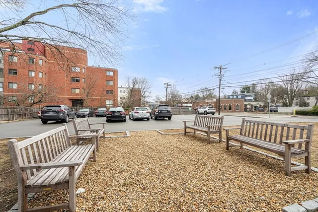 a view of a patio with a table and chairs