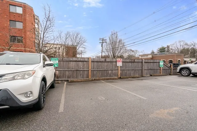 a view of a cars parked in back of a building
