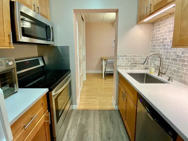 a kitchen with a sink and a microwave