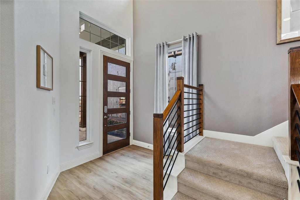 1604 Casting Ridge Mesquite, TX 75181 - Photo 5 of 38 Entryway featuring a dark wood-finish door with frosted glass panels, surrounded by sidelight and transom windows
