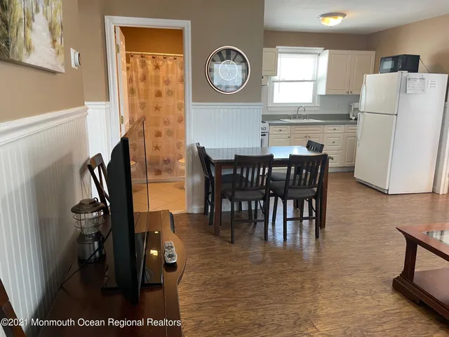 a view of kitchen with dining area and stainless steel appliances
