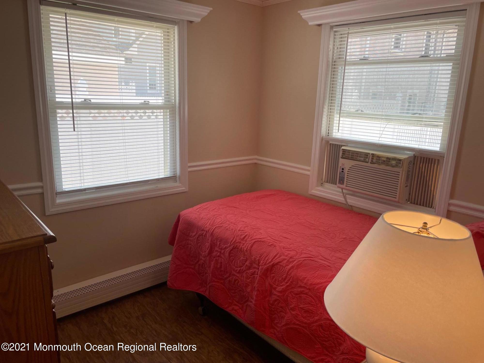 15 Elizabeth Avenue Lavallette, NJ 08735 - Photo 7 of 8 a bedroom with a bed and a window