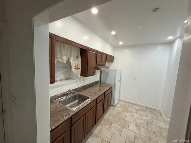 a kitchen with a stove and a refrigerator