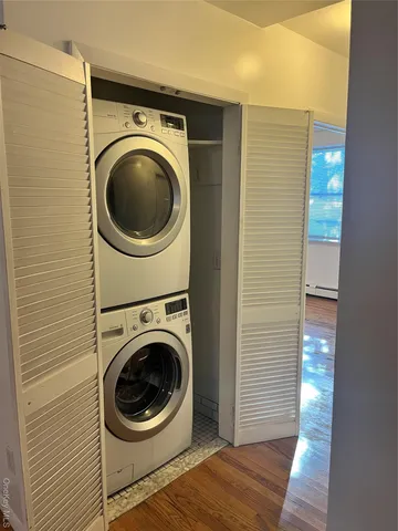 a view of a hallway with washer and dryer