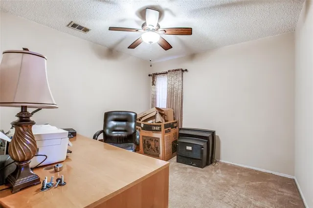 a view of a workspace with furniture