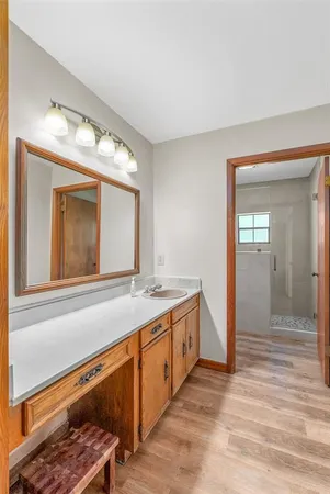 a bathroom with a sink and a mirror