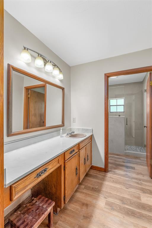 10307 Pirogue Road Oil City, LA 71061 - Photo 22 of 39 a bathroom with a sink and a mirror