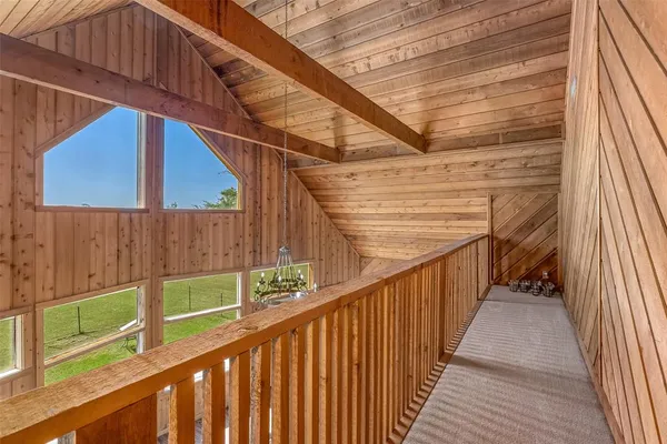 a view of a balcony with wooden floor