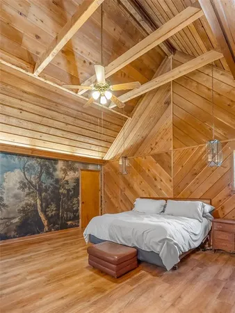a bed sitting in a room next to a window