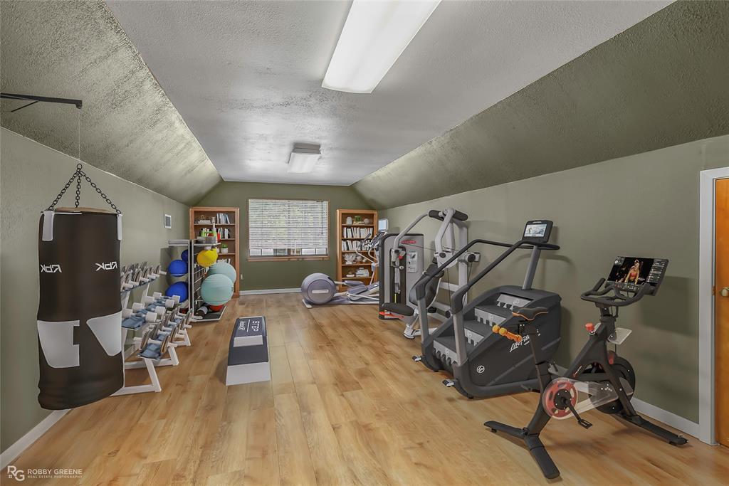 10307 Pirogue Road Oil City, LA 71061 - Photo 35 of 39 a view of a room with gym equipment