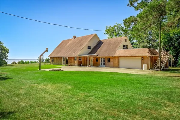 a view of a house with a big yard